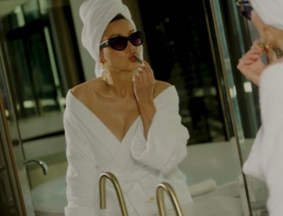 Dannii Minogue in front of Langham Hotel mirror