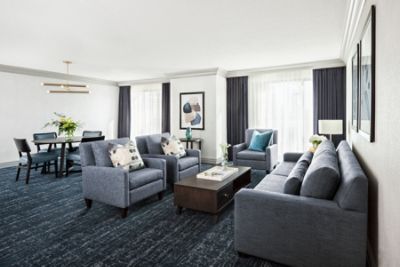 Living area with couches, chairs and dining table