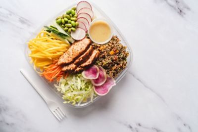 To go container of salad and chicken