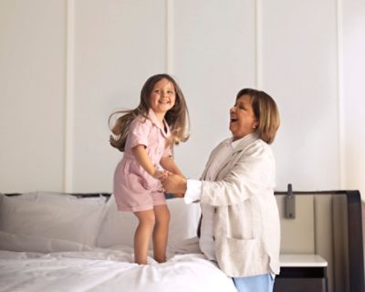 mom and little girl in hotel room