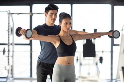 woman workout with personal trainer