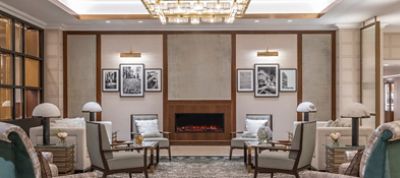 The Langham, Boston lobby sitting area with elegant furnishing in relaxing neutral tones.