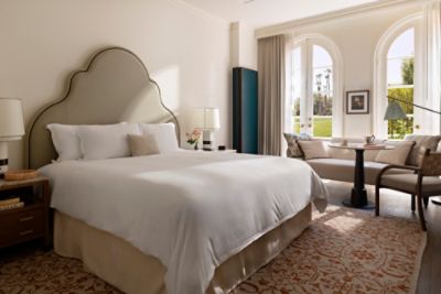 The Langham Huntington, Pasadena Deluxe Patio Room is highlighted by floor-to-ceiling doors which open up to a patio.