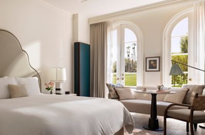 The Langham Huntington, Pasadena Deluxe Patio Room is highlighted by floor-to-ceiling doors which open up to a patio.