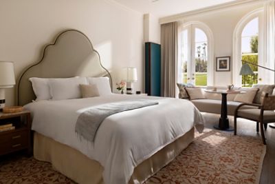 The Langham Huntington, Pasadena Deluxe Patio Room is highlighted by floor-to-ceiling doors which open up to a patio.