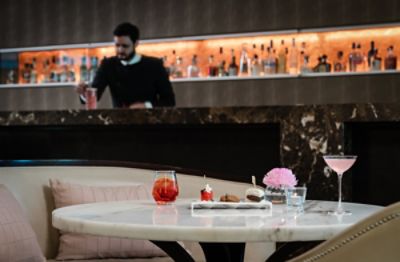 Dine in style with cocktail and canapes at Langham's Aria bar and lounge.