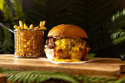 Our Land cocktail bar - Savour classic Kiwi bites and beverages made from quality, locally sourced ingredients.