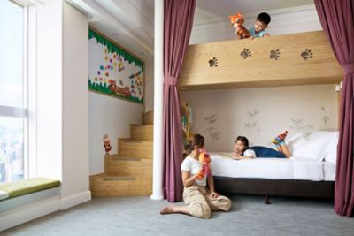 parents and kids having fun on the bunk bed in family quad with kitchen