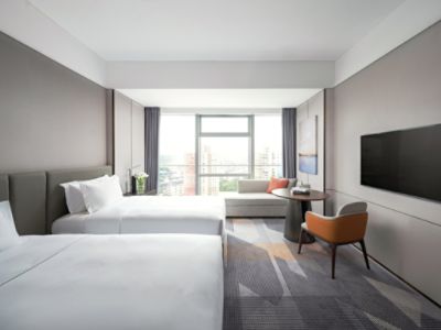 bedroom of superior hotel room with windows