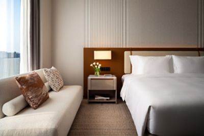 bedroom of superior hotel room with windows