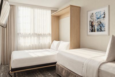 A twin bed and a murphy bed