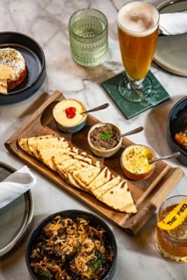 The Fed (Cocktail Bar) Signature Dishes -  the Three Cheese Toastie is a delicious nod to The Langham, London. A Langham favorite stuffed with three cheeses, pickles, onion and dijon. 