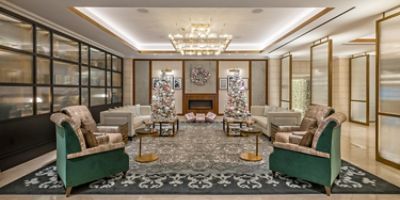 The Langham, Boston lobby sitting area with elegant furnishing in relaxing neutral tones.