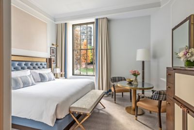 From the comfort of the Park View Club Room's bed, enjoy lovely views of the Norman B Leventhal Park and access to The Langham Club.