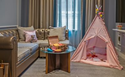 The Bi-Level Family Suite is a two-floor suite, featuring large living area with pull-out sofa and half bath on first floor and master bedroom with bath on second floor.