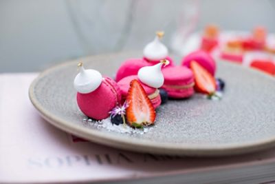 sweet pink macaroons on plate