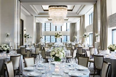 Devonshire Ballroom is a large wedding venue at The Langham, Chicago, featuring a high ceiling and floor-to-ceiling windows