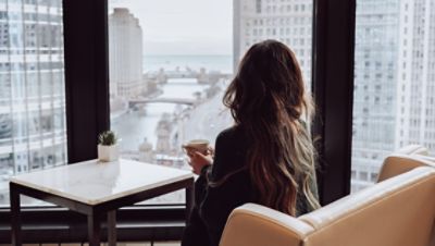 A woman on  a helicopter ride above Chicago