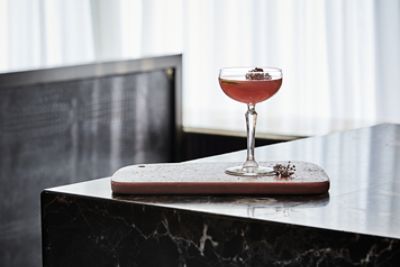 Signature Drink - Langham Celebration, featuring Gin, Champagne and an essence of ginger and rose.