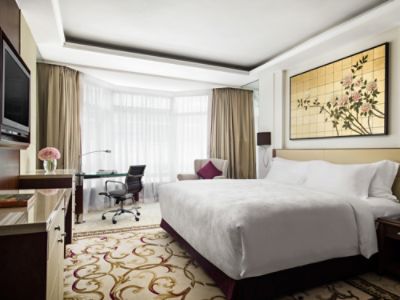 Our Superior City View Rooms offer panoramic views of Kowloon with elegant furnishings and the Langham Blissful Bed.
