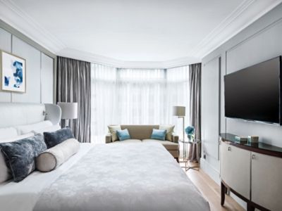 Rest after a long day in the bustling city in the Harmony Suite bedroom featuring the Langham Blissful Bed.