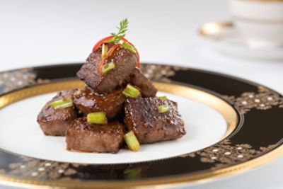 Enjoy stir-fried Japanese Wagyu beef with green vegetables, spring onion and shallots at T'ang Court.