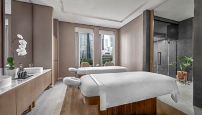 Chuan Spa's single spa suite adorned with bronze and wood features timeless elegant chic and lavish private spa experience.