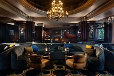 Featuring a decorative fireplace and cozy couches, The Tap Room is perfect for a night out with friends.