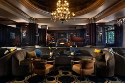 Featuring a decorative fireplace and cozy couches, The Tap Room is perfect for a night out with friends.