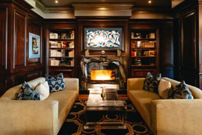 Featuring a decorative fireplace and cozy couches, The Tap Room is perfect for a night out with friends.