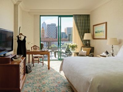 The Deluxe Balcony Room features a balcony perfect for enjoying sunsets and cityscapes.