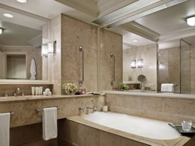 The Deluxe Balcony Room's sumptuous marble bathroom offers a separate shower and bath.