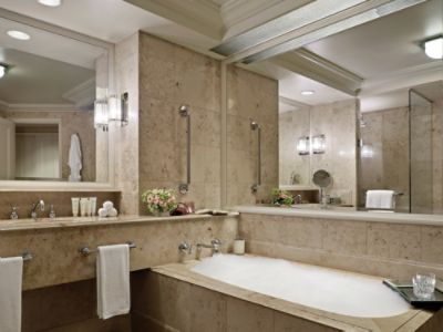 The Deluxe River Room's sumptuous marble bathroom offers a separate shower and bath.