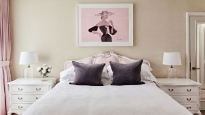 Indulge in the luxuriously dreamKerrie Hess Residence Suite elegantly furnished in pink and white.