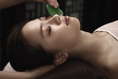 Signature Treatment - Facial Treatment - features healing jade stones and Gua Sha therapy to heal and restore the skin.