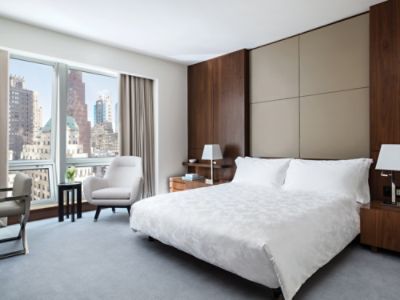 tlnyc-deluxe-room-bedroom.jpg